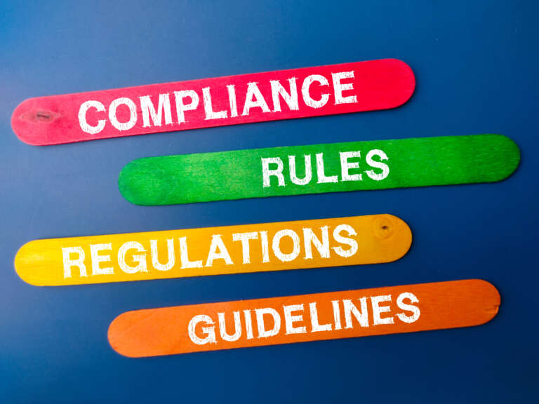 Colored ice cream stick with the word COMPLIANCE RULES REGULATIONS GUIDELINES. Business concept.